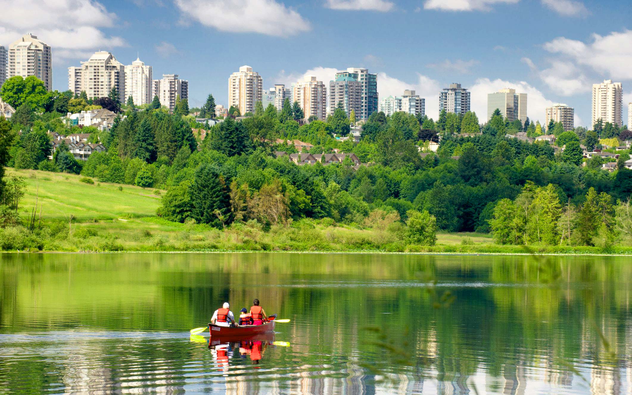 Jim’s Mowing in Burnaby Burnaby lake landscape with the city on the back